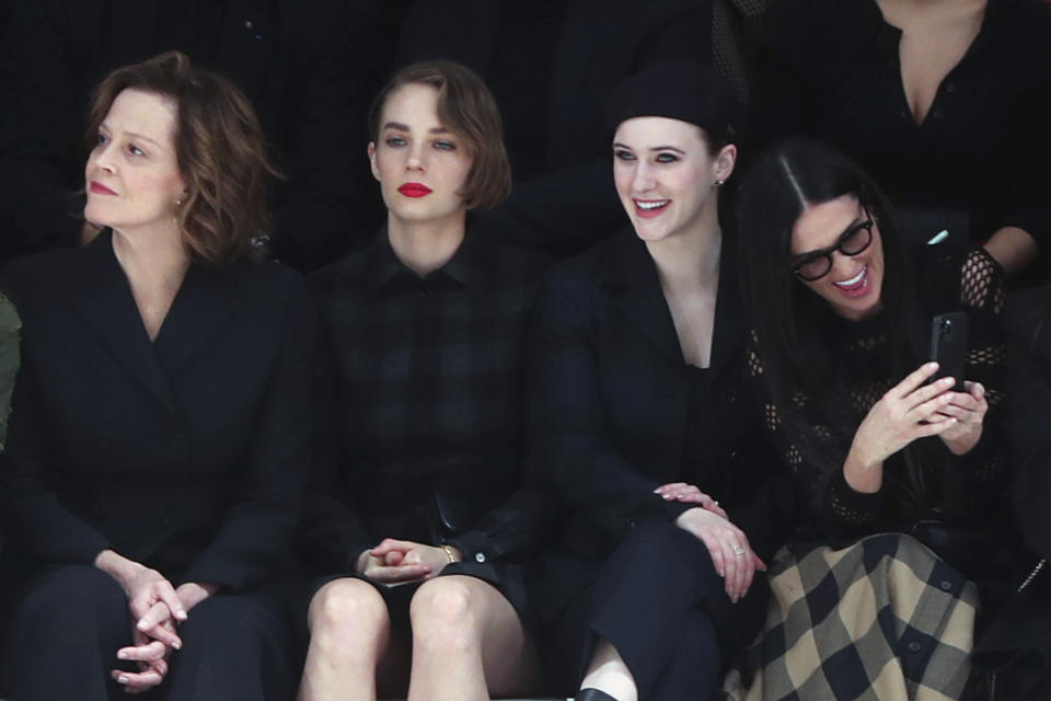 From left, Sigourney Weaver, her daughter Charlotte, Rachel Brosnahan and Demi Moore attend the Dior fashion collection during Women's fashion week Fall/Winter 2020/21 presented in Paris, Tuesday, Feb. 25, 2020. (AP Photo/Thibault Camus)