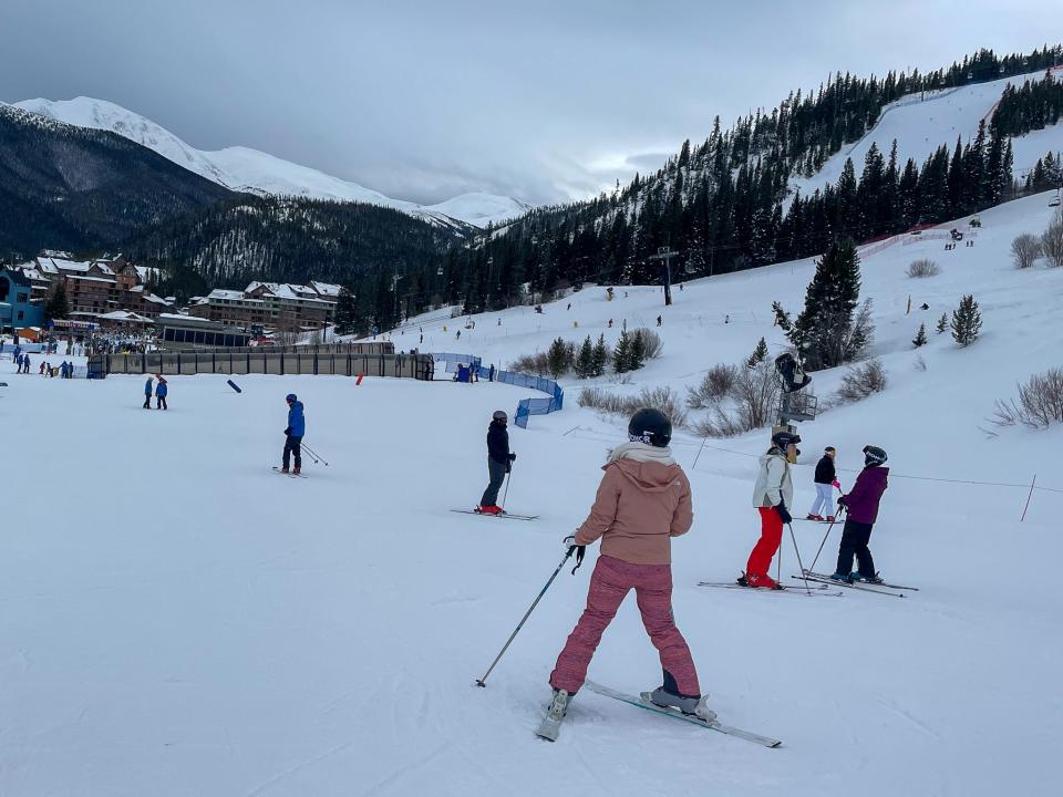 A skier forms a pizza shape on the mountain.