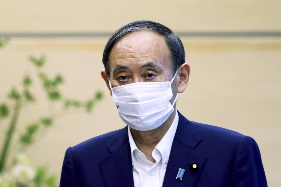 Japanese Primm Minister Yoshihide Suga waits to meet International Paralympic Committee President Andrew Parsons, in Tokyo Friday, Sept.3, 2021. Suga said Friday he won’t run for leadership of the governing party at the end of this month, paving the way for a new Japanese leader after just a year in office. (Behrouz Mehri/Pool Photo via AP)