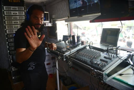 Asif Butt, better known by his stage person DJ Butt, performs during a political rally in Islamabad