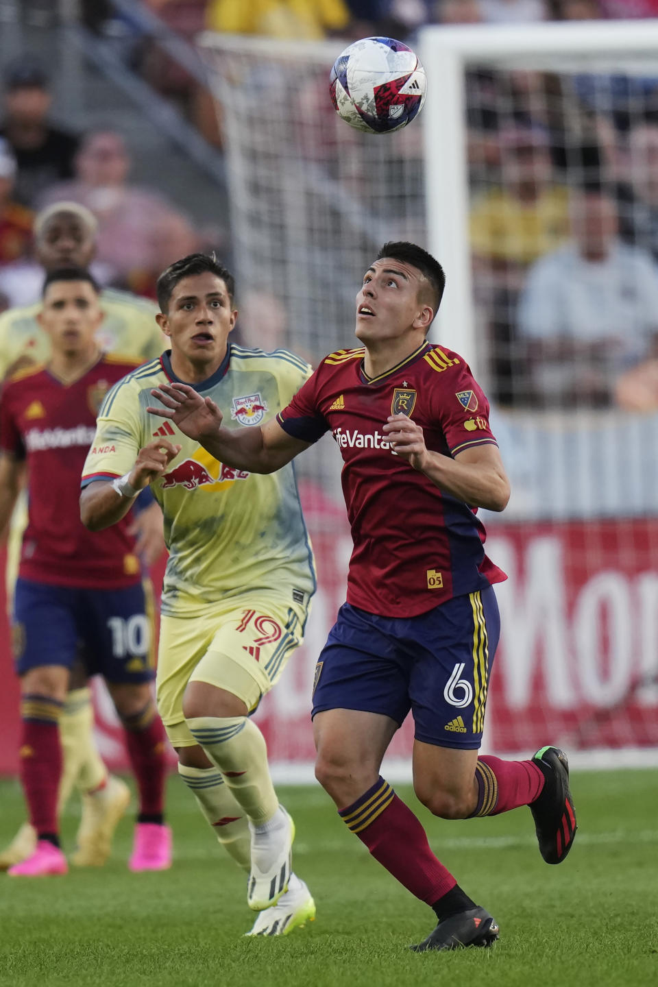 New York Red Bulls midfielder Wikelman Carmona (19) defends against Real Salt Lake midfielder Braian Ojeda (6) during the first half of an MLS soccer match Saturday, July 15, 2023, in Sandy, Utah. (AP Photo/Rick Bowmer)