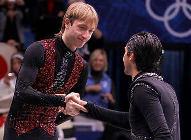 Lysacek (R) shakes hands with silver medalist Evgeni Plushenko of Russia