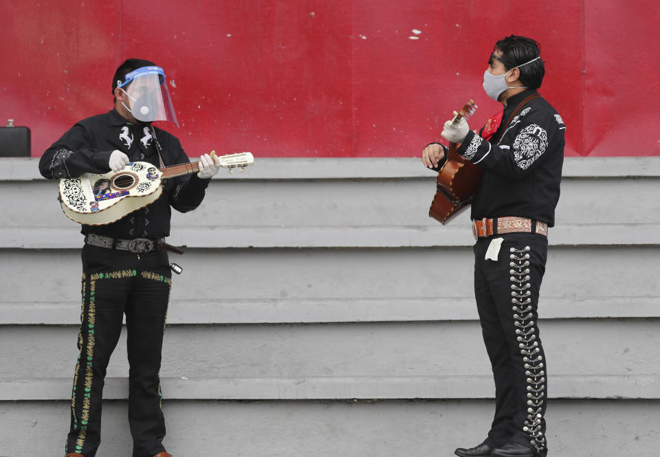 Musicians from Mariachi groups perform during an event to appeal that authorities allow them to work this upcoming Mother's Day in Quito, Ecuador, Tuesday, May 5, 2020. Mariachis have not been able to perform and earn a living since the government ordered in mid-March a national lockdown that includes restrictions on traffic and pedestrian movement to curb the spread of the new coronavirus. (AP Photo / Dolores Ochoa)