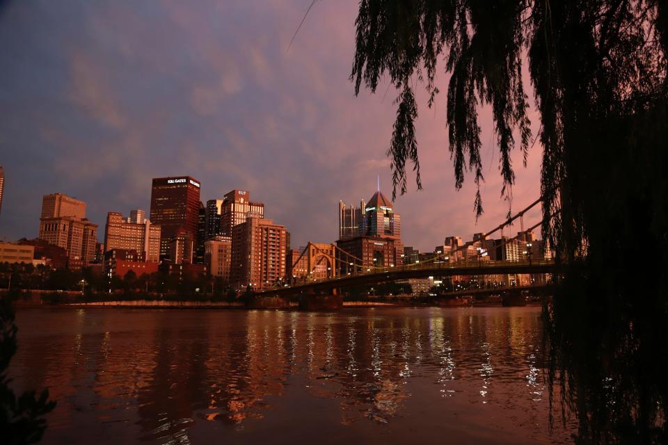 The sunsets over on the skyline of downtown Pittsburgh Thursday, July 11, 2019.