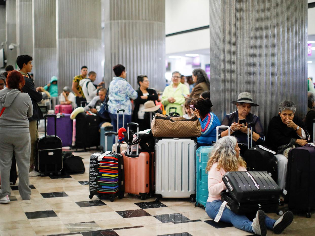 Passengers gather at Terminal 1 of Benito Juarez International Airport