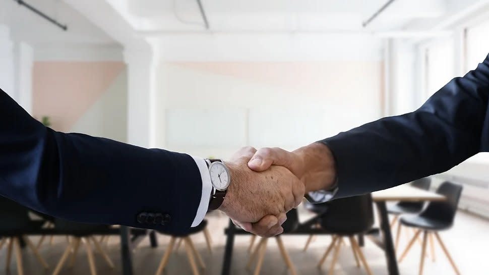  Business people shaking hands. 