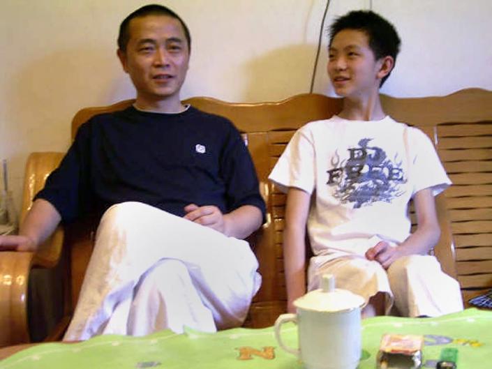 Dissident Huang Qi (L), pictured with his son at their home in Chengdu, south-west China's Sichaun province, in 2009 (AFP Photo/-)