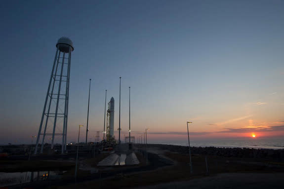 The sun rises over NASA's Wallops Flight Facility, where the first Antares rocket built by Orbital Sciences stands poised to launch on its test flight from Wallops Island on Virginia's Eastern Shore. Liftoff set for 5 pm ET on April 17, 2013.