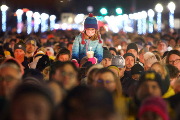 People attend a vigil downtown on Dec. 3 to honor those killed and wounded during the recent shooting at Oxford High School in Oxford, Michigan. (Scott Olson/Getty Images)