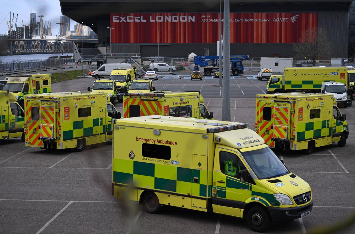 London Ambulances are pictured parked in the car park at the ExCeL London exhibition centre in London on March 29, 2020, which has been transformed into a field hospital to be known as the NHS Nightingale Hospital, to help with the novel coronavirus COVID-19 pandemic. - Prime Minister Boris Johnson warned Saturday the coronavirus outbreak will get worse before it gets better, as the number of deaths in Britain rose 260 in one day to over 1,000. The Conservative leader, who himself tested positive for COVID-19 this week, issued the warning in a leaflet being sent to all UK households explaining how their actions can help limit the spread. "We know things will get worse before they get better," Johnson wrote. (Photo by DANIEL LEAL-OLIVAS / AFP) (Photo by DANIEL LEAL-OLIVAS/AFP via Getty Images)