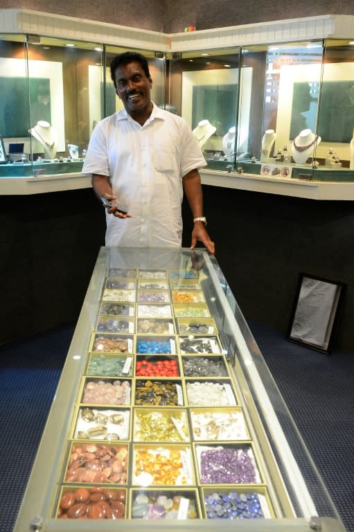 Sri Lankan jewellery dealer Nisha Abeygunawardena poses for a photo at one of his stores in Bentota, some 65 km south of Colombo
