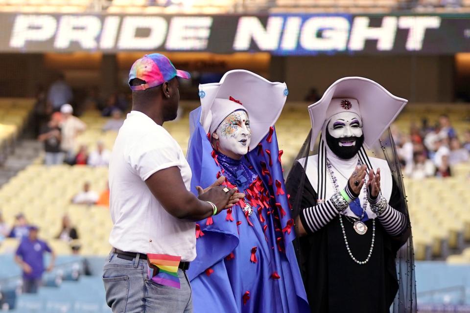 Gerald Garth stands with members of the Sisters of Perpetual Indulgence.