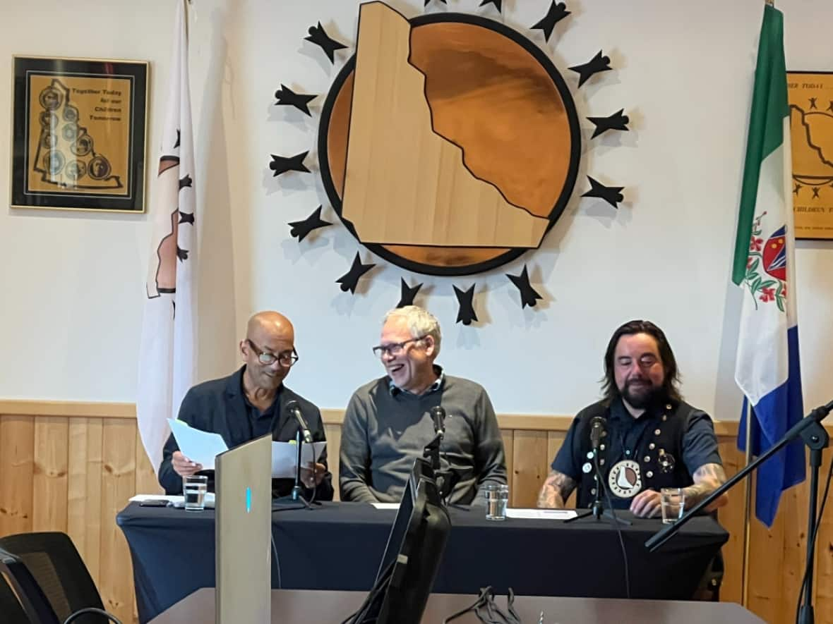 Ranj Pillai, minister responsible for the Yukon Housing Corporation, John Streicker, minister responsible for Energy, Mines and Resources, and CYFN Grand Chief Peter Johnston, at a news conference Wednesday.  (Mike Rudyk/CBC - image credit)