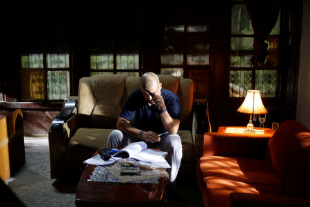 An Iraqi actor reads his script to prepare for a scene of Òthe hotelÓ TV series, which is being filmed and broadcast during the Muslim holy month of Ramadan, in Baghdad, Iraq May 10, 2019. Picture taken May 10, 2019. REUTERS/Thaier al-Sudani