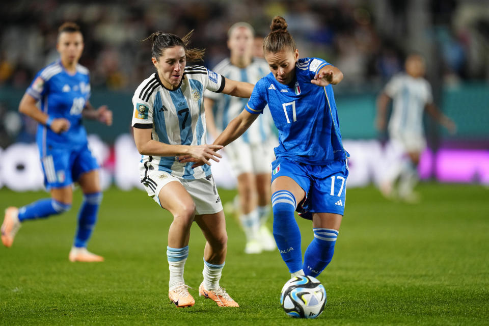 Argentina's Romina Nunez, left, and Italy's Lisa Boattin vie for the ball during the Women's World Cup Group G soccer match between Italy and Argentina at Eden Park in Auckland, New Zealand, Monday, July 24, 2023. (AP Photo/Abbie Parr)