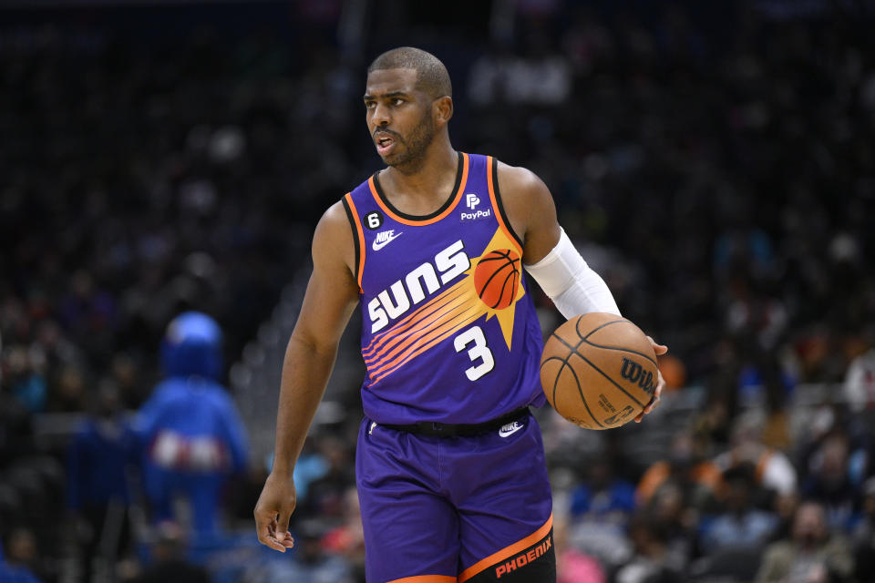 Phoenix Suns guard Chris Paul brings the ball up during the first half of the team's NBA basketball game against the Washington Wizards, Wednesday, Dec. 28, 2022, in Washington. (AP Photo/Nick Wass)