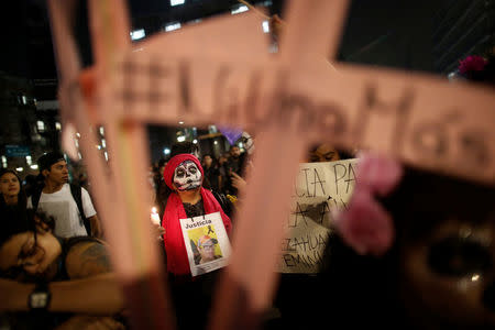 Activists with their faces painted to look like the popular Mexican figure "Catrina" take part in a march against femicide during the Day of the Dead in Mexico City, Mexico, November 1, 2017.REUTERS/Carlos Jasso