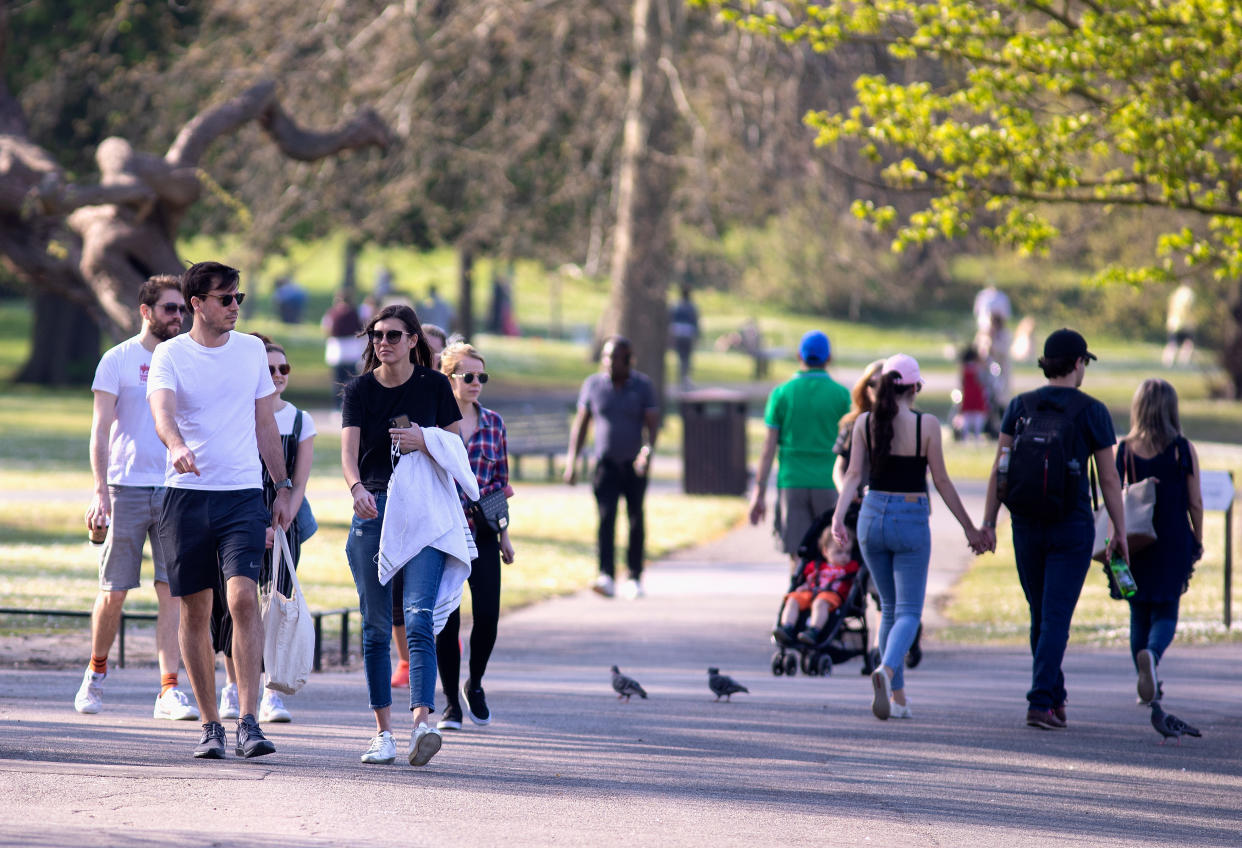 LONDON, ENGLAND - APRIL 10: Groups of People walking in Regents Park, Good Friday on April 10, 2020 in London. There have been around 70,000 reported cases of the COVID-19 coronavirus in the United Kingdom and 8,000 deaths. The country is in its third week of lockdown measures aimed at slowing the spread of the virus. (Photo by Jo Hale/Getty Images)