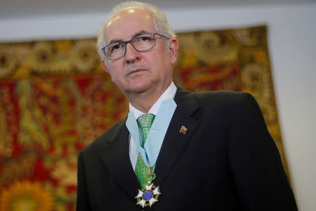 FILE PHOTO: Venezuelan exiled veteran opposition figure and former mayor of Caracas Antonio Ledezma wears an Order Medal Of Cruzeiro Do Sul after receiving it form Brazil's Foreign Minister Aloysio Nunes Ferreira (not pictured), at the Itamaraty Palace in Brasilia, Brazil April 27, 2018. REUTERS/Adriano Machado/File Photo
