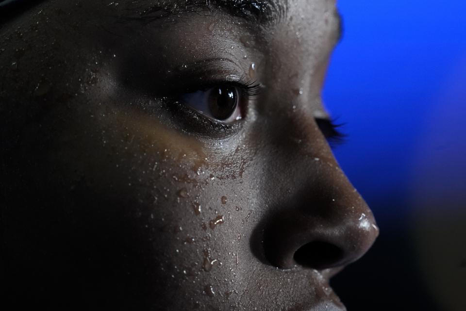 Simone Manuel reacts after the women's 50 freestyle during wave 2 of the U.S. Olympic Swim Trials on Sunday, June 20, 2021, in Omaha, Neb. (AP Photo/Charlie Neibergall)