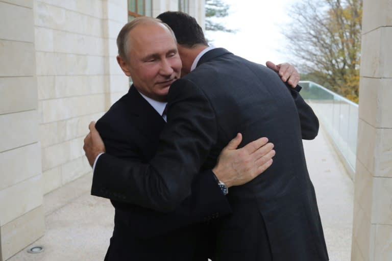 Russia's President Vladimir Putin embraces his Syrian counterpart Bashar al-Assad during a meeting in Sochi last month