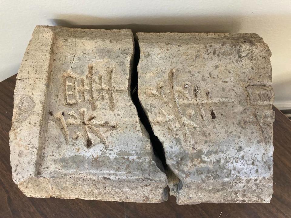 A broken headstone that was brought to Old City Cemetery earlier in 2023. A worker had found it at a job site in East Sacramento. Lori Bauder, the city’s cemetery manager, would like to find someone who can translate the language on the headstone.