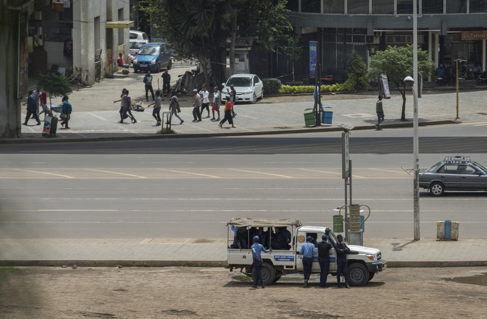 Security forces stand guard in Meskel Square in central Addis Ababa, Ethiopia, Sunday, June 23, 2019. Ethiopia's government foiled a coup attempt in a region north of the capital and the country's military chief was shot dead, the prime minister Abiy Ahmed said Sunday in a TV announcement. (AP Photo/Mulugeta Ayene)