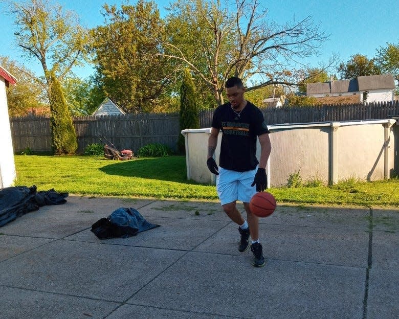 Dom Welch hooping at home. His father Angelo would kick kids off the court so his son could play.