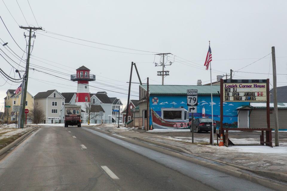 Vehicles drive along State Route 79 into the village of Buckeye Lake, Ohio on Friday, February 11, 2022.
