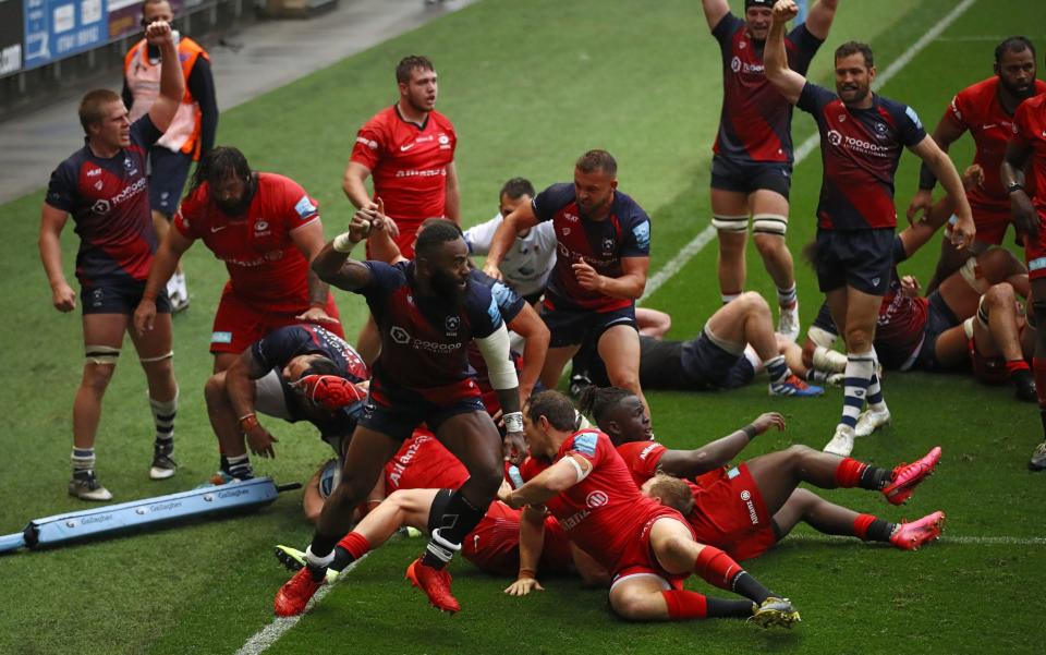 Bristol Bears' Semi Radradra (centre) celebrates the try of team-mate Siale Piutau during the Gallagher Premiership match at Ashton Gate, Bristol. PA Photo. Picture date: Saturday August 15, 2020.  - PA