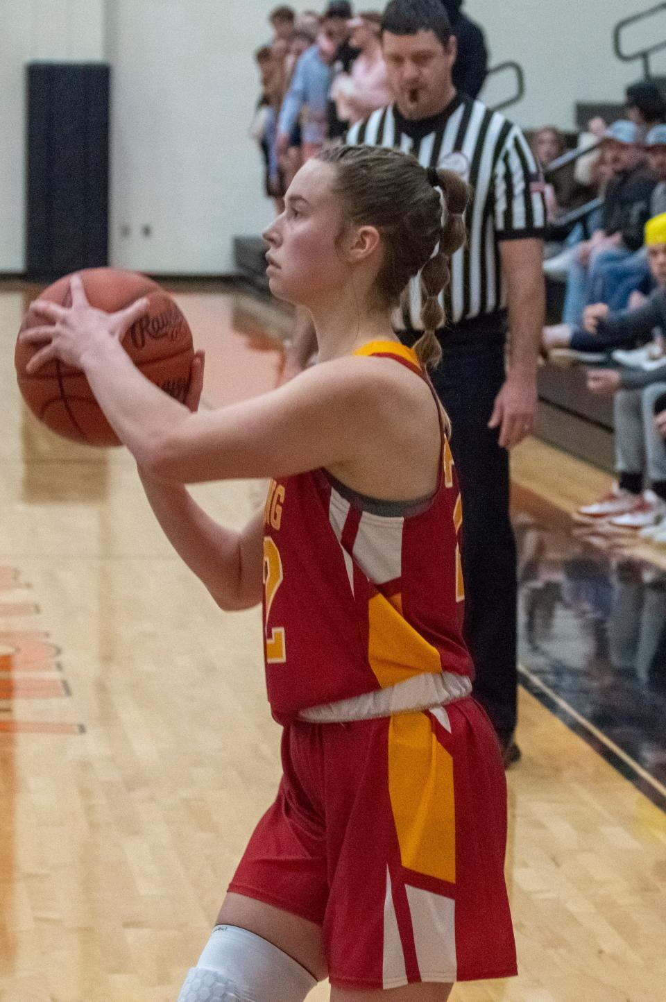 Reading junior Taylor Engel looks to sink a 3-poitner against the Jonesville Comets.