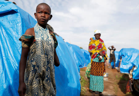 Mave Grace, 11, who had part of her arm chopped off by militiamen when they attacked the village of Tchee, stands in an Internally Displaced Camp in Bunia, Ituri province, eastern Democratic Republic of Congo, April 12, 2018. REUTERS/Goran Tomasevic