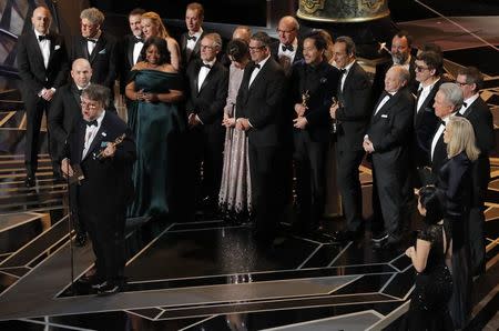 90th Academy Awards - Oscars Show - Hollywood, California, U.S., 04/03/2018 - Guillermo del Toro (L) accepts the Oscar for Best Picture for "The Shape of Water." REUTERS/Lucas Jackson