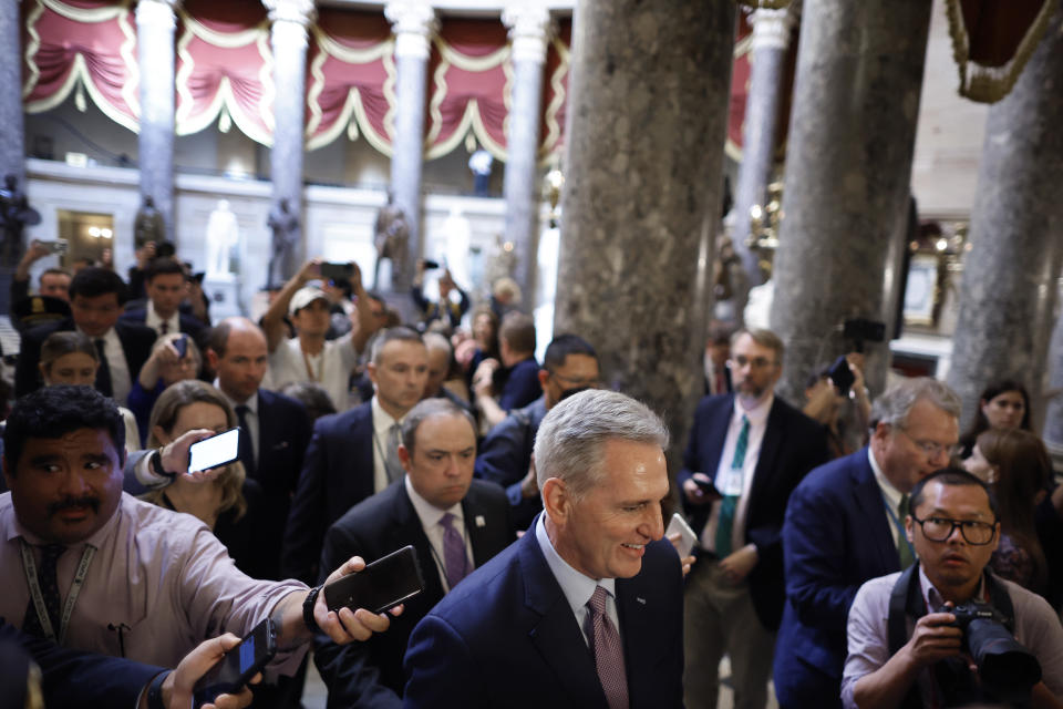 WASHINGTON, DC - OCTOBER 03: Speaker of the House Kevin McCarthy (R-CA) is surrounded by staff, security and journalists as he walks to the House Chamber ahead of a vote at the U.S. Capitol on October 03, 2023 in Washington, DC. McCarthy's speakership is being challenged by a handful of conservative members of his own party lead by Rep. Matt Gaetz (R-FL) following a deal to keep the federal government from partially shutting down over the weekend. (Photo by Chip Somodevilla/Getty Images)