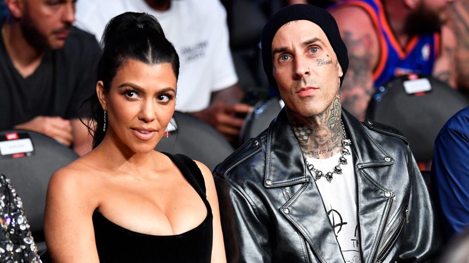 Kourtney Kardashian and Travis Barker are seen in attendance during the UFC 264 event at T-Mobile Arena on July 10, 2021 in Las Vegas, Nevada.