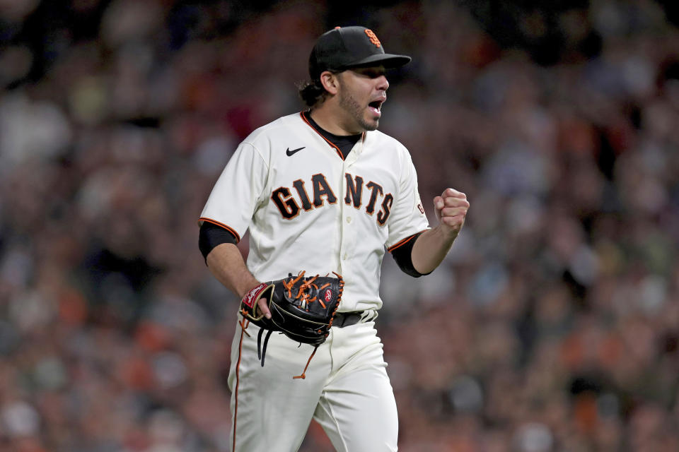 San Francisco Giants' Jose Alvarez reacts after striking out Arizona Diamondbacks' Josh Rojas during the seventh inning of a baseball game in San Francisco, Thursday, Sept. 30, 2021. (AP Photo/Jed Jacobsohn)