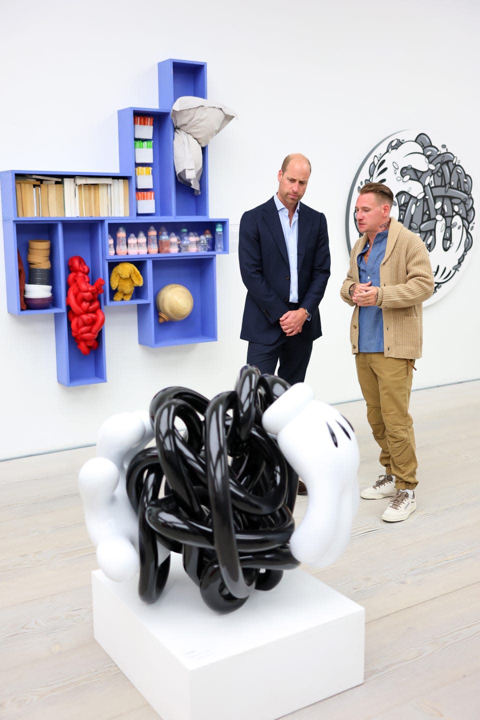 london, england september 05 prince william, prince of wales observing the art pieces during the homelessness reframed exhibition at the saatchi gallery on september 05, 2024 in london, england prince william met with artists behind the newly commissioned works for the exhibition, as well as individuals whose personal experiences have served as inspiration for some of the pieces photo by chris jacksongetty images