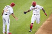 Washington Nationals Howie Kendrick, right, rounds the bases after hitting a home run during the first inning of a baseball game against the New York Mets in Washington, Tuesday, Aug. 4, 2020. (AP Photo/Manuel Balce Ceneta)