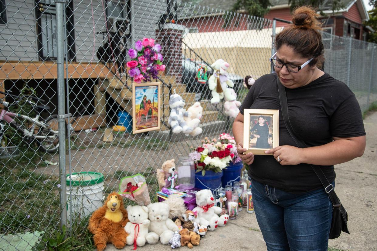 Claudia Stapleton, aunt of Emma Hernandez, 9, holds a photo of her outside of her home in Detroit on Tuesday, Aug. 20, 2019.