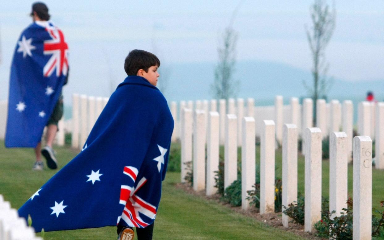 People walk after the wreath-laying ceremonies at the Australian National Memorial in Villers-Bretonneux, northern France on Anzac Day in 2011 - AP