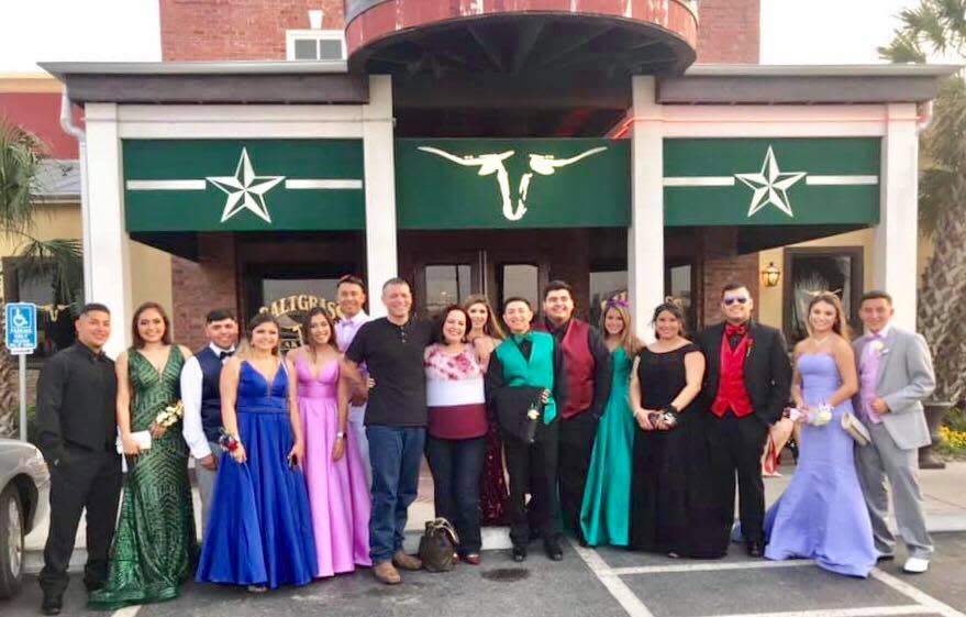 Jacob and Christina Parks (center) are credited with saving prom for these teens. (Photo: Courtesy of Marisa Trevino)