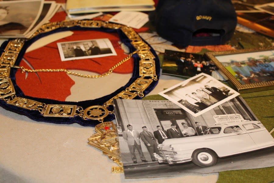 U.S. Navy memorabilia and old photographs of Ira “Ike” Schab, 103, are displayed on the kitchen table in his home in Beaverton, Ore. on Monday, Nov. 20, 2023. Schab was in the Navy and on the USS Dobbin during the Pearl Harbor attacks on Dec. 7, 1941. Eighty-two years later, Schab plans to return to Pearl Harbor on the anniversary of the attack to remember the more than 2,300 servicemen killed. (AP Photo/Claire Rush)