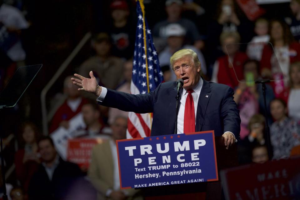 Donald J. Trump, the Republican Presidential nominee at the time, holds a rally, with a sign in front: Trump Pence.