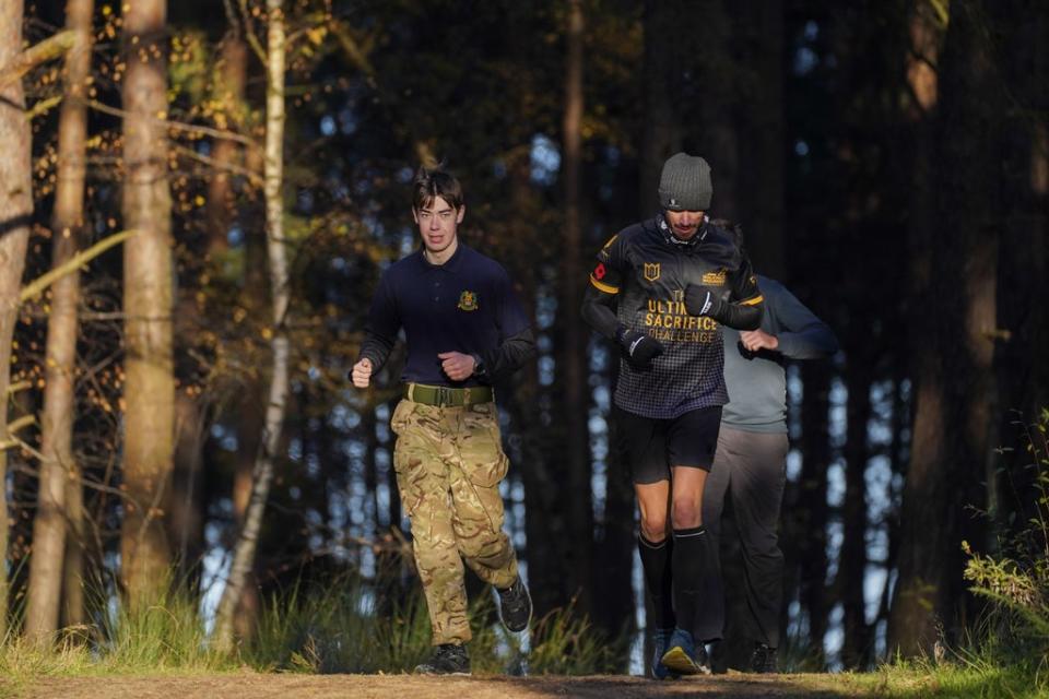 Veteran Brian Wood MC (right) with his son Bailey (left) (Steve Parsons/PA) (PA Wire)