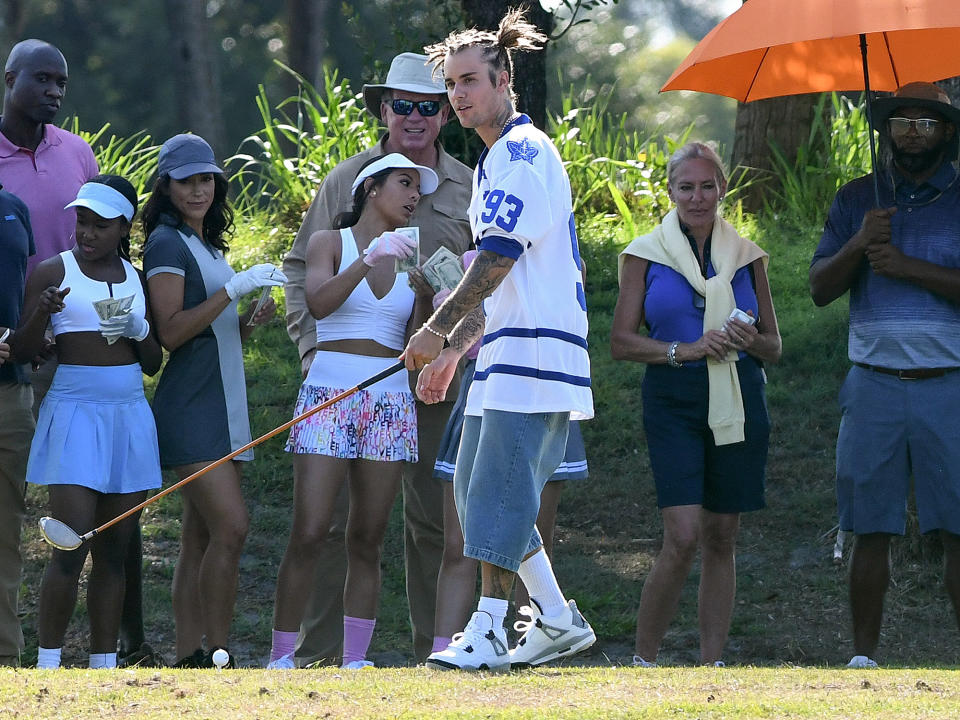 <p> Justin Bieber tees up while filming a <i>Happy Gilmore</i>-themed music video in Miami on Sunday. </p>