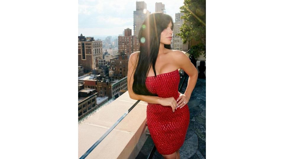 Lauren Sanchez poses on rooftop with NY skyline behind her