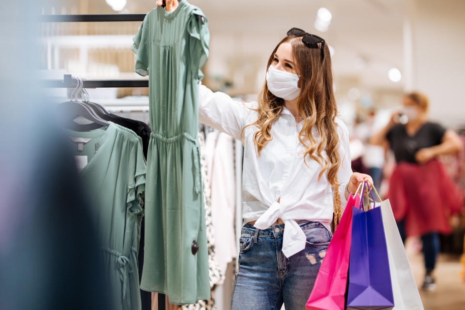 Woman shopping protecting herself wearing protective mask