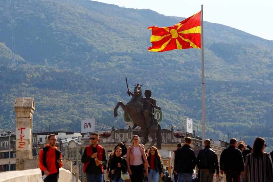 People pass over the stone bridge in Skopje, North Macedonia April 19, 2019. REUTERS/Ognen Teofilovski