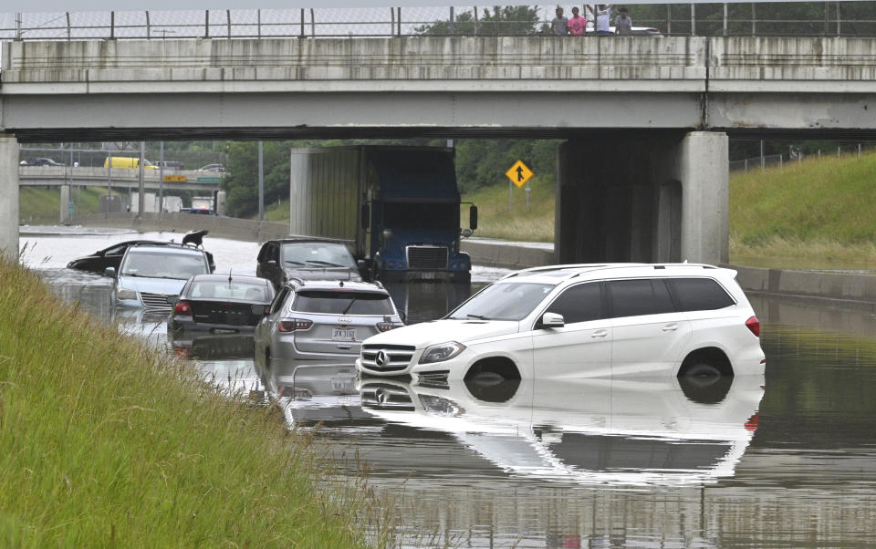 Cars sit in floodwaters on Interstate 94 at 30th Street in Detroit on Saturday, June 26, 2021 after heavy rain hit the metro area. (Max Ortiz/Detroit News via AP)