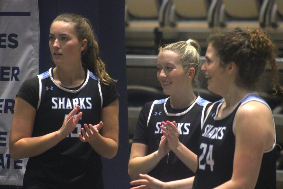 Ponte Vedra's Taylor Perce (15), Morgan Gavazzi (1) and Alyssa James (24) applaud as teammates attempt shots in Monday's practice at the University of North Florida.